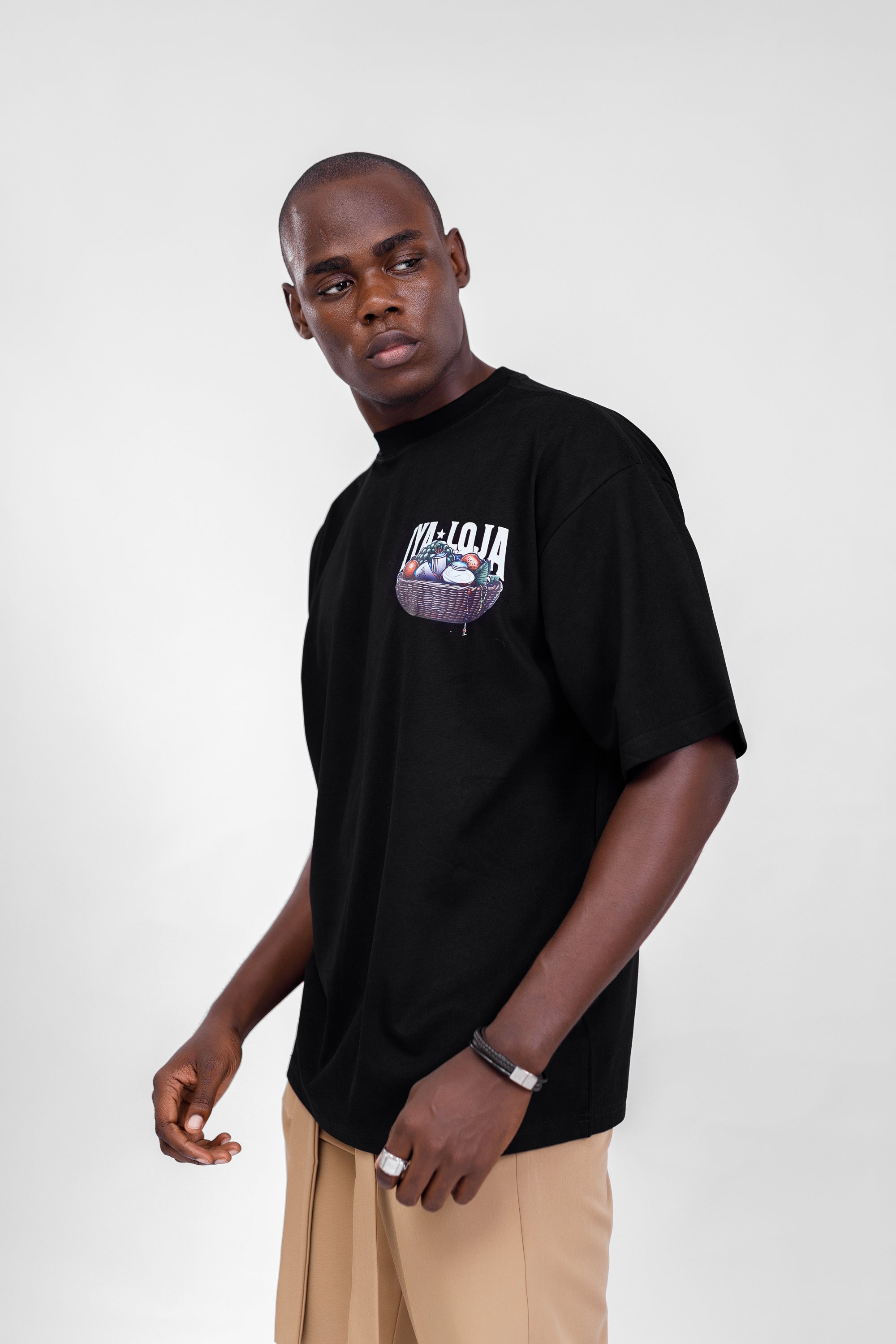 Iyaloja Tee (Pocket Logo) in Black